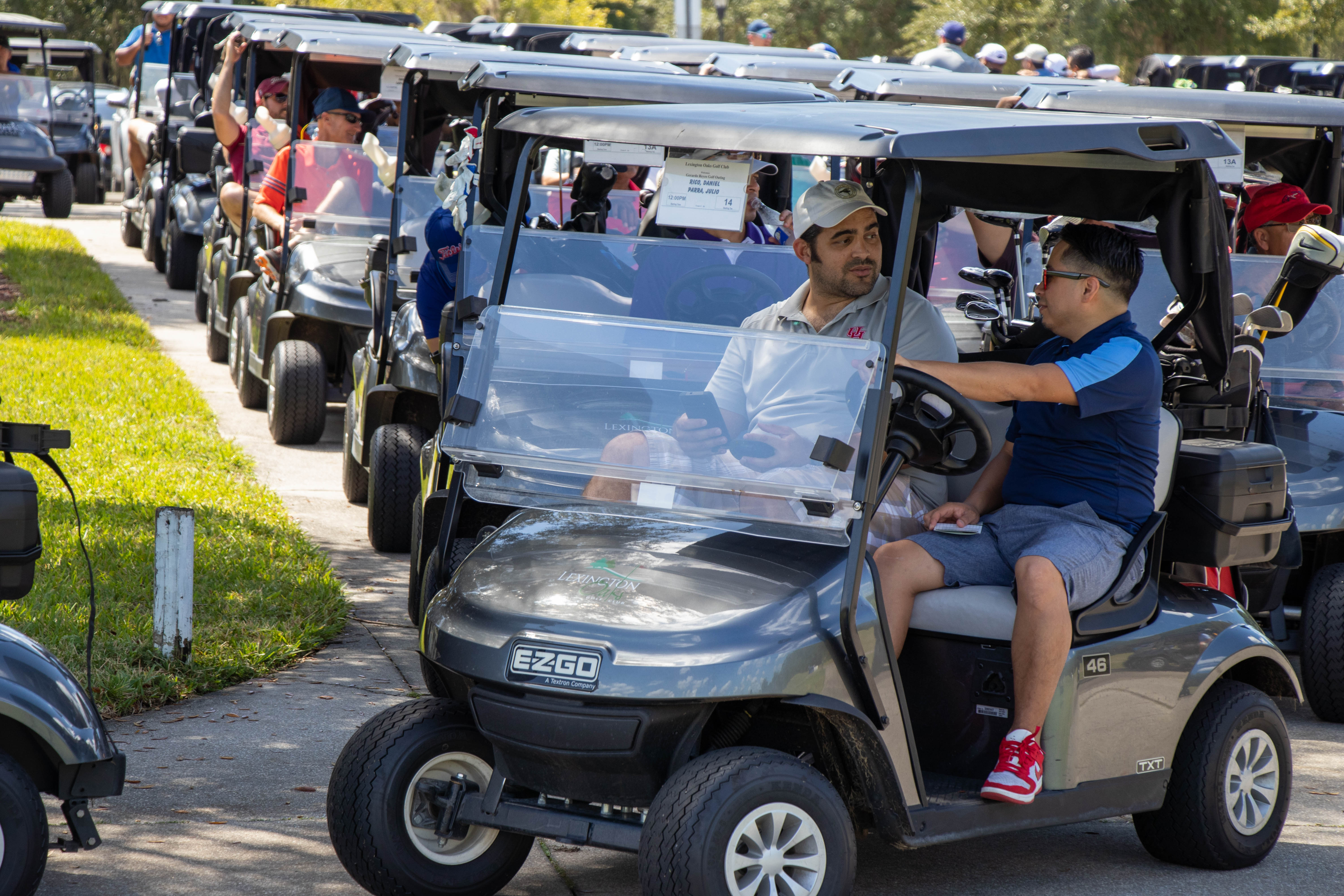 Golfers on golf cart